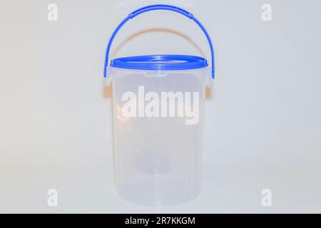The Versatile Blue Plastic Cylinder Container with Lid is a practical and functional storage solution for your everyday needs Stock Photo