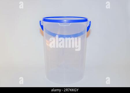 The Versatile Blue Plastic Cylinder Container with Lid is a practical and functional storage solution for your everyday needs Stock Photo