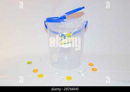 The Versatile Blue Plastic Cylinder Container with Lid is a practical and functional storage solution for your everyday needs. Stock Photo