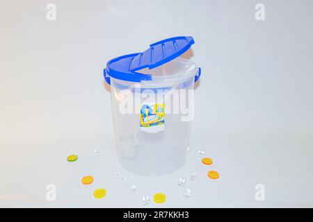 The Versatile Blue Plastic Cylinder Container with Lid is a practical and functional storage solution for your everyday needs. Stock Photo