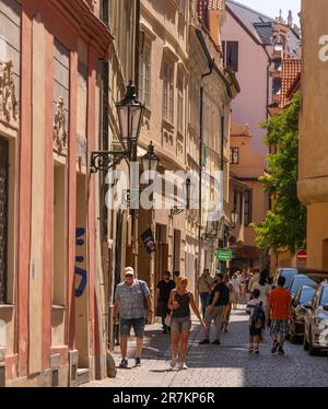 PRAGUE, CZECH REPUBLIC, EUROPE - Toutists walking on narrow street in Old Town, Stare Mesto. Stock Photo