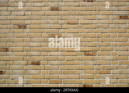 Background from a wall made of beige clinker bricks Stock Photo