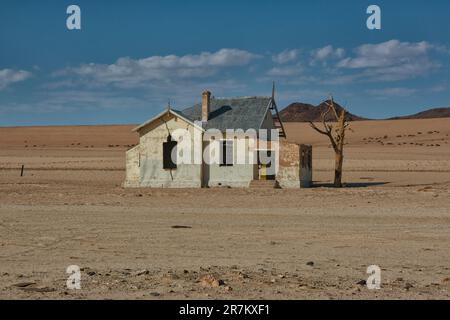 The destroyed building of the railway station and railway in the Namib Desert Stock Photo