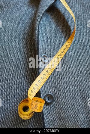 measuring tape and woman's jacket Stock Photo