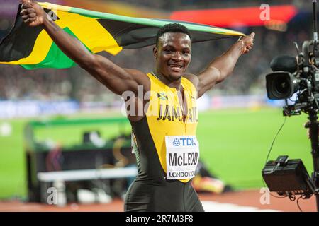 Omar MCLEOD winning in the 110m hurdles  final and celebrating with the flag of his country at the World Athletics Championships London 2017. Stock Photo