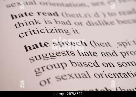 A mock up of a dictionary page with the word Hate Speech with selective focussing Stock Photo