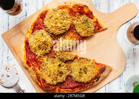 Home made vegan breaded eggplant pizza. Stock Photo