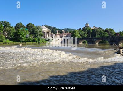 The river Po in Turin photographed by the Murazzi. On the hill the church of Santa Maria dei Capuccini. In the background the Napoleon stone bridge Vi Stock Photo