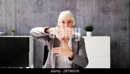 Online Meeting On Computer Using Sign Language Stock Photo