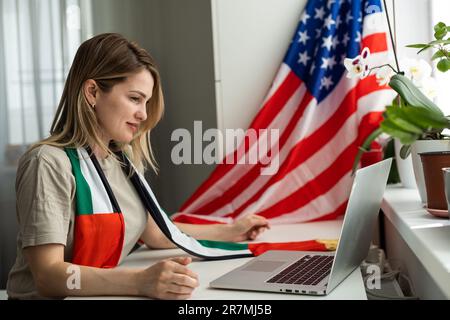 Student at desk studying free online American university academic course during global Covid 19 pandemic, writing essay, scholarship application Stock Photo