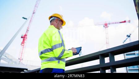 Osha Inspector At Construction Site. Young Engineer Worker Stock Photo