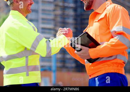 Construction Site Worker Hand Shake. Engineer Handshake Stock Photo
