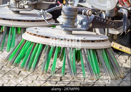 Street cleaning machine gathers trash, garbage and leaves Stock Photo