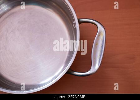 empty kitchen gray pan stands on a table Stock Photo