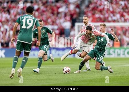 Copenhagen, Denmark. 16th June, 2023. Andreas Christensen (6) of Denmark and Ali McCann (16) of Northern Ireland seen during the UEFA Euro 2024 qualification match between Denmark and Northern Ireland at Parken in Copenhagen. (Photo Credit: Gonzales Photo/Alamy Live News Stock Photo