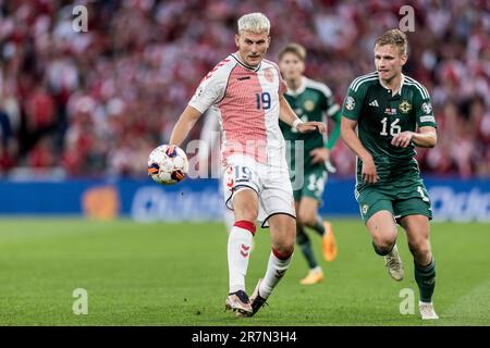 Copenhagen, Denmark. 16th June, 2023. Jonas Wind (19) of Denmark and Ali McCann (16) of Northern Ireland seen during the UEFA Euro 2024 qualification match between Denmark and Northern Ireland at Parken in Copenhagen. (Photo Credit: Gonzales Photo/Alamy Live News Stock Photo