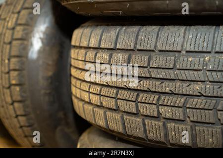 Used car tires in the workshop. Stock Photo