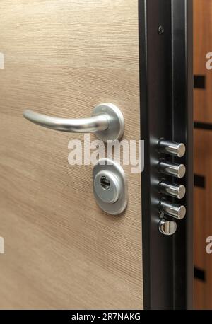 Safety lock on the safety door, metal handle, close up Stock Photo