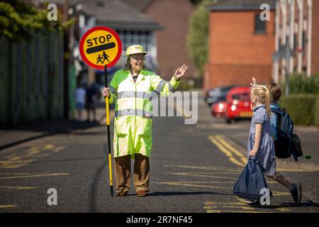 Lollipop lady Veronica Hammersley, 93, who works on the school crossing patrol at Glengormley Integrated Primary School in Northern Ireland, who has been awarded the BEM (British Empire Medal), for services to the community in Glengormley, County Antrim, in the King's Birthday Honours list. Picture date: Wednesday June 14, 2023. Stock Photo