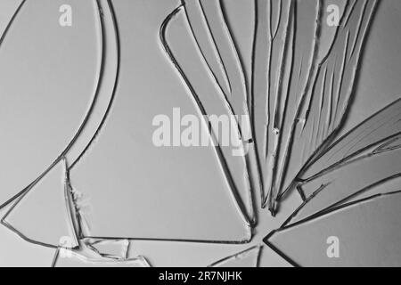 Broken glass pile pieces of texture and background isolated on white, cracked window effect. Emergency condition Stock Photo