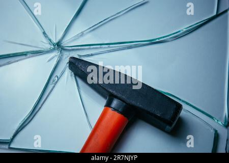 Broken glass background for your images isolated on white. Many large fragments scattered from the blow with a hammer Stock Photo