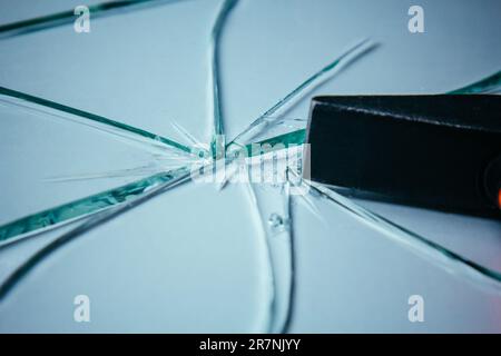 Broken glass background for your images isolated on white. Many large fragments scattered from the blow with a hammer Stock Photo