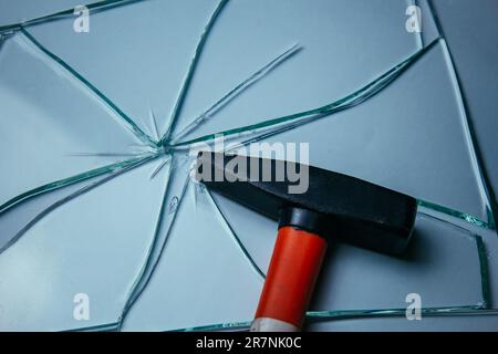 Broken glass background for your images isolated on white. Many large fragments scattered from the blow with a hammer Stock Photo
