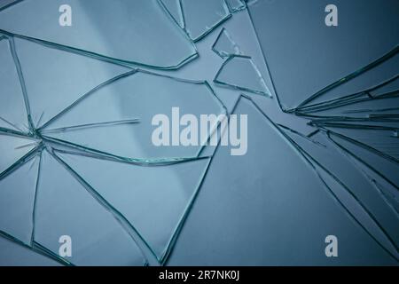 Broken glass pile pieces of texture and background isolated on white, cracked window effect. Emergency condition Stock Photo