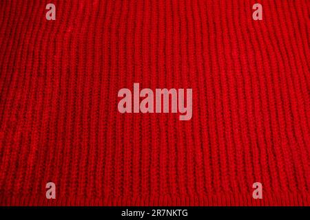 Pattern of colorful knitted sweaters closeup. Handmade merino wool product. Knitting patterns Stock Photo