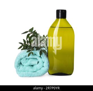 Bottle of shampoo and terry towel on white background Stock Photo