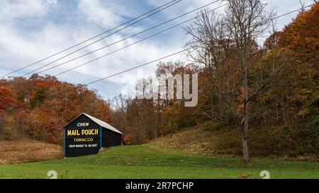 Marietta, Ohio, USA-Oct. 25, 2022: Illustrative editorial of a barn with a traditional Mail Pouch tobacco advertisement painted on it. Stock Photo