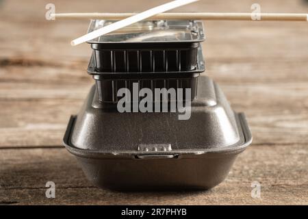 plastic packaging for sushi delivery from a restaurant on a table close-up Stock Photo