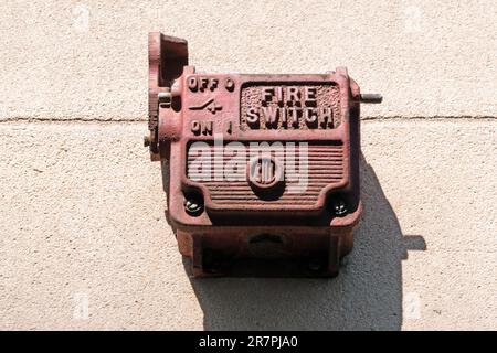 Close up image of an old fire alarm switch on side of a building Stock Photo