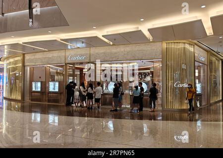 Customers line up at a luxury goods store in Shanghai, China, June 16, 2023. Stock Photo