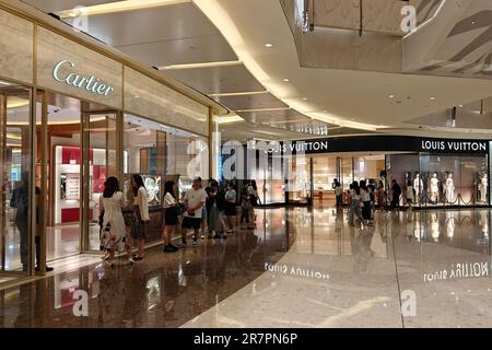 Customers line up at a luxury goods store in Shanghai, China, June 16, 2023. Stock Photo