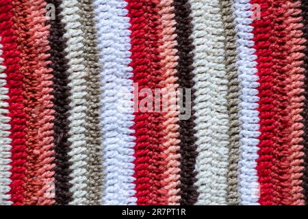 striped colored grandma's carpet multicolored red white black as background, floor carpet Stock Photo