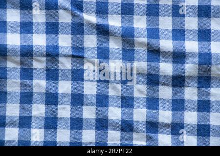 fabric in a cage blue with white as a background close-up Stock Photo