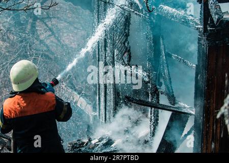 Brave firefighter saving burning building. Firefighter work concept ...
