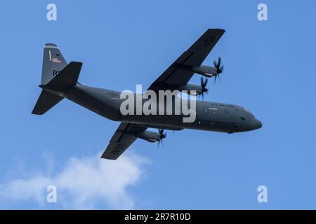 US Air Force C-130 Hercules aircraft in flight Stock Photo