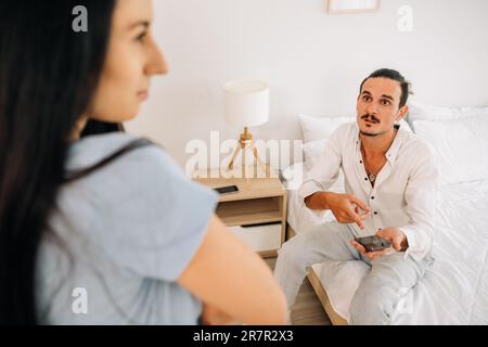 Upset and unhappy couple with problems, Young couple having quarrel Stock Photo