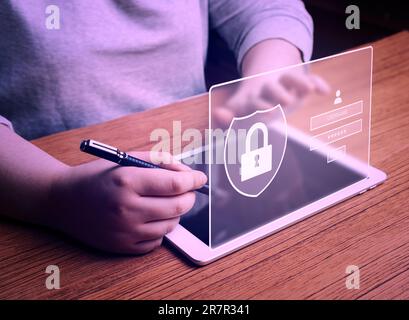 Woman using digital tablet to login with holographic scanner authentication. Cyber security concept. Data protection and secured internet access. Stock Photo