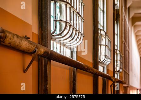 Windows with security bars of a corridor of a module and a block of the federal prison of Alcatraz Island located in the middle of the San Francisco. Stock Photo