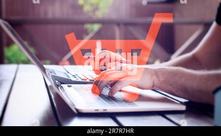 concept of online shopping, using a laptop Stock Photo