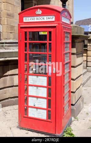 Book swap telephone box, Elland, West Yorkshire Stock Photo