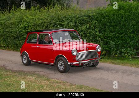 1970, 70s, seventies, 1970 Morris Mini Cooper Red Car Petrol 998 cc ; a range of rare, exciting and unusual vehicle enthusiasts & attendees at Worden Park Motor Village showcase, Leyland Festival, UK Stock Photo