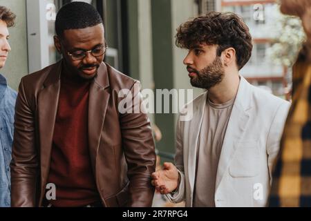 Two business partners having a project conversation while taking a break from work Stock Photo
