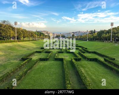 The central lane of Eduardo VII Park, with Lisbon and the Tagus river in the background Stock Photo