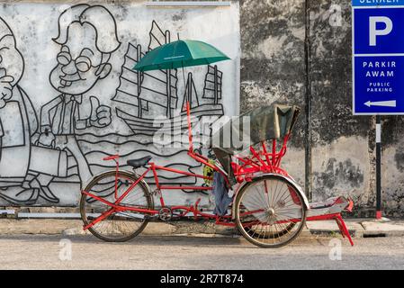 Parked cycle rickshaw in the old town of the capital of Penang, George Town Stock Photo