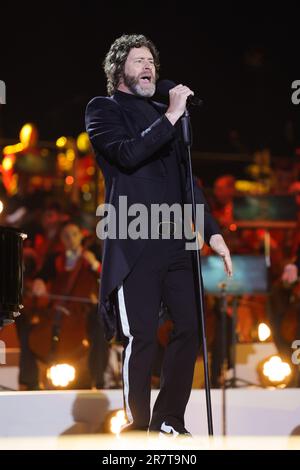 File photo dated 17/06/23 of Howard Donald from Take That performs on stage at the Coronation Concert at Windsor Castle, Berkshire. The singer has said he is 'deeply sorry' after making a 'huge error' by 'liking social media posts that are derogatory towards the LGBTQIA+ community'. Donald, 55, who performs in the pop group alongside Gary Barlow and Mark Owen, has been dropped from playing at Groovebox's Nottingham Pride Festival event in July. Issue date: Saturday June 17, 2023. Stock Photo