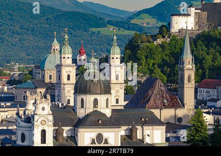 Salzburg, city in Austria, view at the old town and historic centre, with Collegiate Church, Franciscan Church and Salzburg Cathedral. Stock Photo